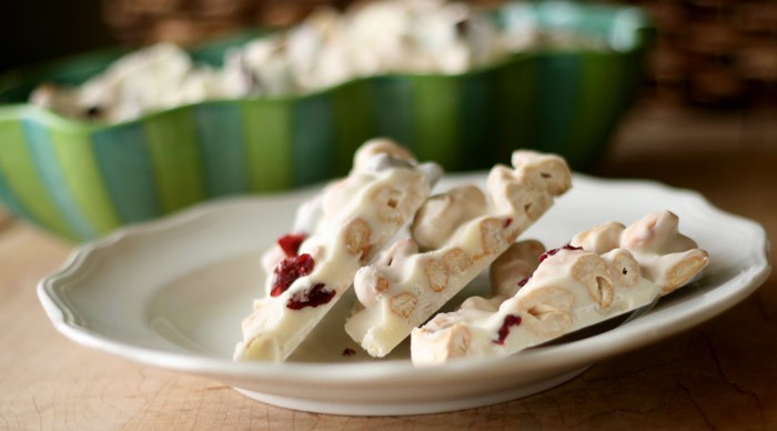 Cranberry Cashew Bark stacked on a plate side view.