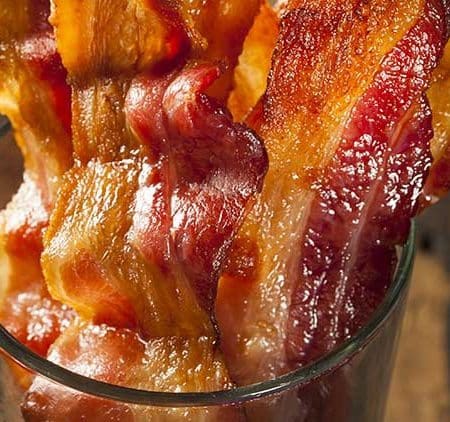 oven cooked bacon is easy to make. Cook oven fried bacon in the oven for an easier way to make bacon. This is a simple no hassle cooking method that we've used repeatedly to make bacon in the oven.