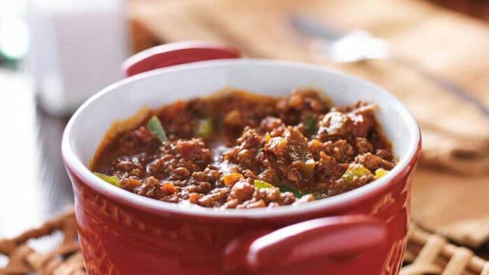game day chili in a red bowl