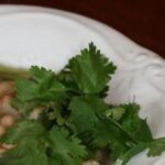 Slow Cooker White Chicken Chili is spicy, delicious and gluten free. This easy weeknight meal can be tossed together in the slow cooker in no time.