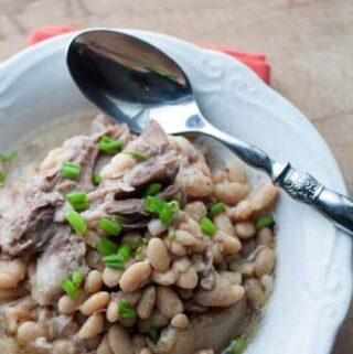 White Beans and Ham Budget Meal. White Beans and Ham is a simple budget meal that feeds a crowd and tastes great. This is one of those slow cooker recipes you can make ahead of time and have ready for a crowd. Stress free meal that feeds a lot of people.
