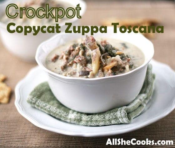 zuppa toscana in white bowl sitting on green towel and white plate