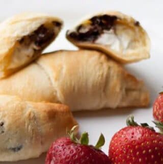 Chocolate Cream Cheese Croissants recipe is a quick and easy breakfast recipe to fancy up any breakfast or brunch. Served with strawberries.