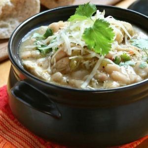 White Chicken Chili recipe is one of the best fall soup recipes (and chili recipes) we have. This flavorful white bean and chicken chili is so hearty. It is also the perfect way to use up Thanksgiving turkey leftovers. Substitute turkey for chicken and make this a budget friendly after Thanksgiving recipe. Great way to use up leftovers!