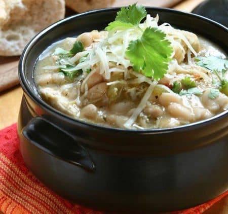 White Chicken Chili recipe is one of the best fall soup recipes (and chili recipes) we have. This flavorful white bean and chicken chili is so hearty. It is also the perfect way to use up Thanksgiving turkey leftovers. Substitute turkey for chicken and make this a budget friendly after Thanksgiving recipe. Great way to use up leftovers!