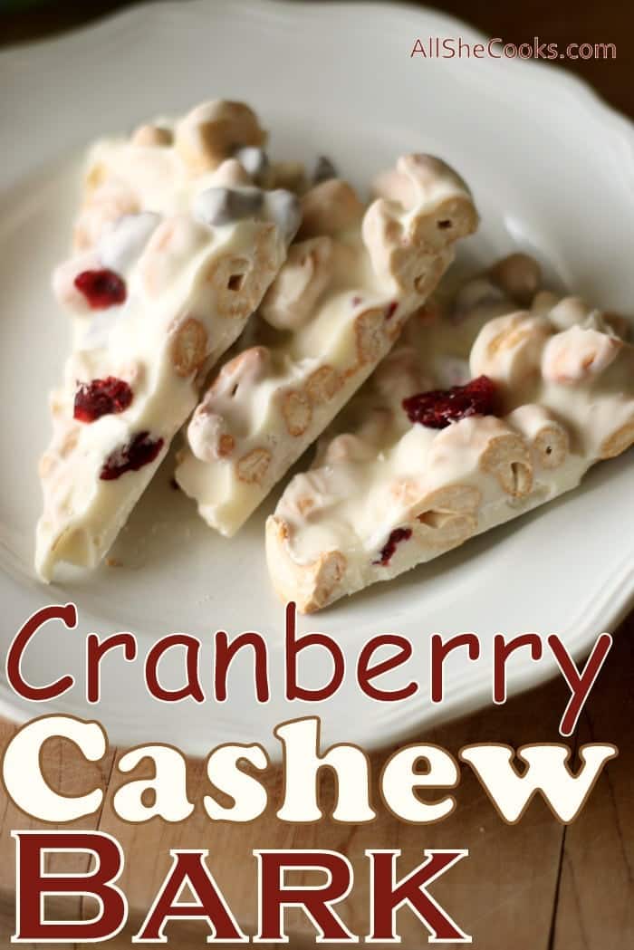 Cranberry Cashew Bark pieces on a white plate.