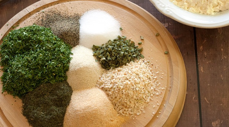 herbs grouped together on a platter to be used in homemade ranch dressing mix