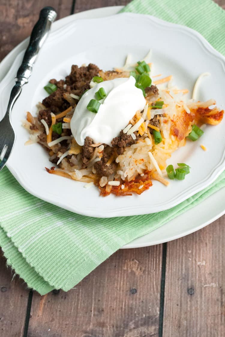 Slow Cooker Spicy Taco Baked Potatoes by All She Cooks