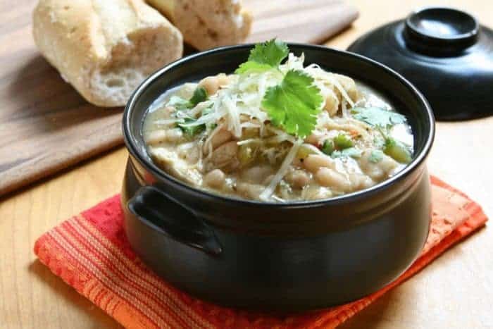 white chicken chili being served in a crock