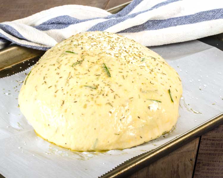 bread dough on baking sheet with parchment paper