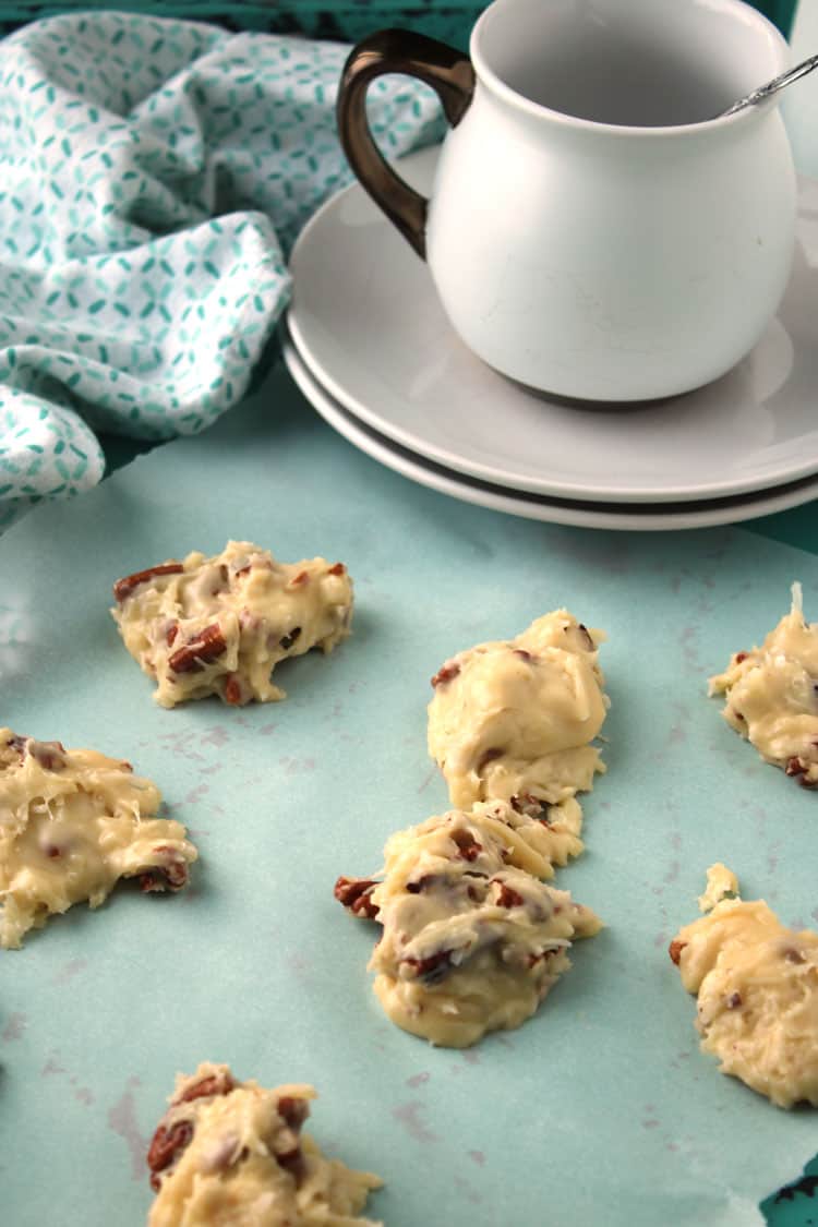 blue towel with coconut clusters on top and a saucer and cup in the background