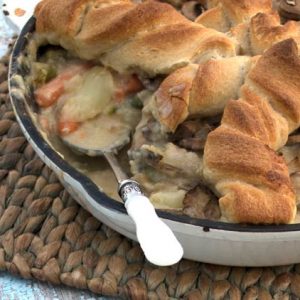 Chicken Pot Pie perfect for a potluck. This recipe is a comfort food favorite with flavor you won't soon forget. Make this for dinner & take it to potlucks.