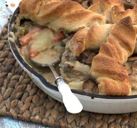 Chicken Pot Pie perfect for a potluck. This recipe is a comfort food favorite with flavor you won't soon forget. Make this for dinner & take it to potlucks.