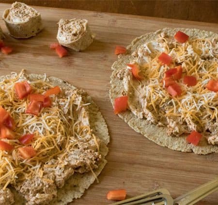 Vegetarian Southwest Pinwheels are the perfect party food. This easy appetizer recipe for Vegetarian Sausage Pinwheels gives you all the flavor you want in a vegetarian recipe that is perfect for a quick lunch, school lunch, appetizer or snack solution.