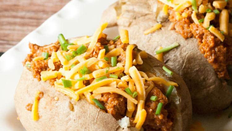 chili baked potatoes being served