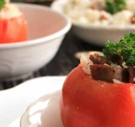 Rice and sausage stuffed tomatoes make an easy entree or dinner recipe. Serve with additional rice and sausage to a make a full meal with a side salad.