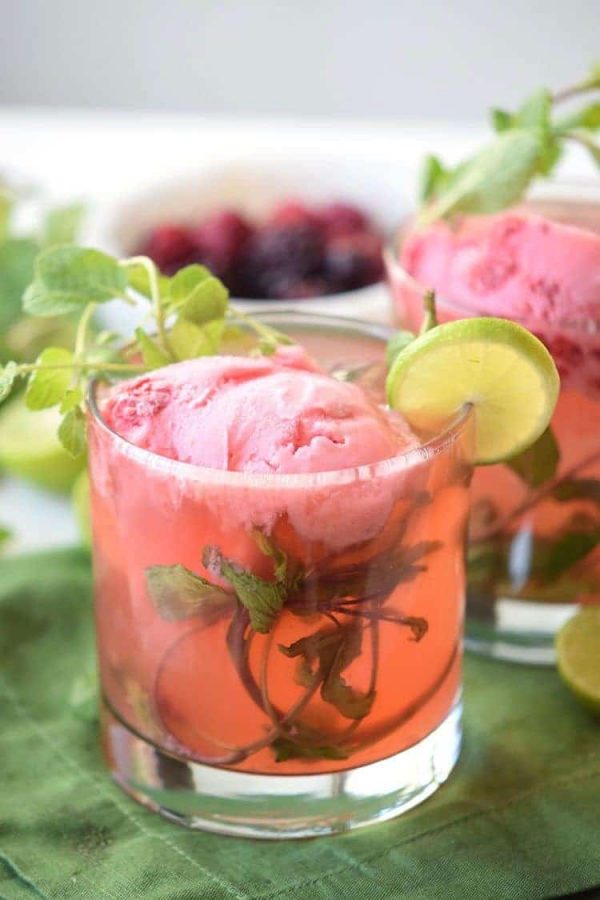 Try this fun cocktail float. This Strawberry Mojito Float is a refreshing alcoholic beverage perfect for sharing with friends or for an evening cocktail.