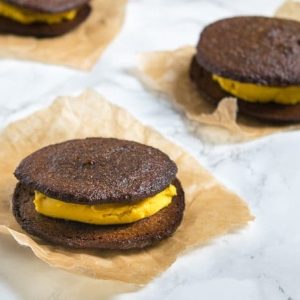 Pumpkin Cream Filled Whoopie Pies - a healthy pumpkin cookie filled with velvety pumpkin cream for a delicious fall treat!
