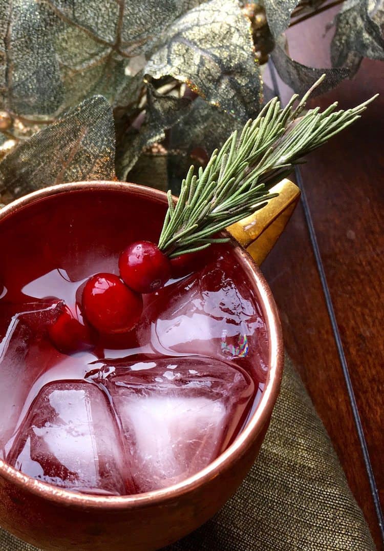 cranberry moscow mule being served with a pretty garnish