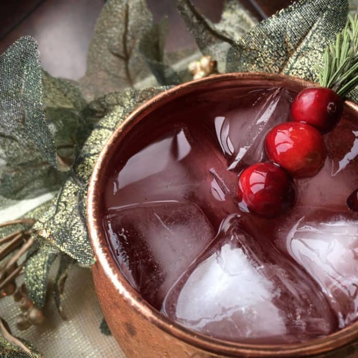 cranberry moscow mule with a rosemary sprig