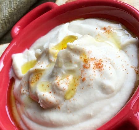 Herbed White Bean Dip with Toasted Pita Chips is a simple dip recipe that is perfect to serve at a holiday party. Appetizer recipes are always winners.