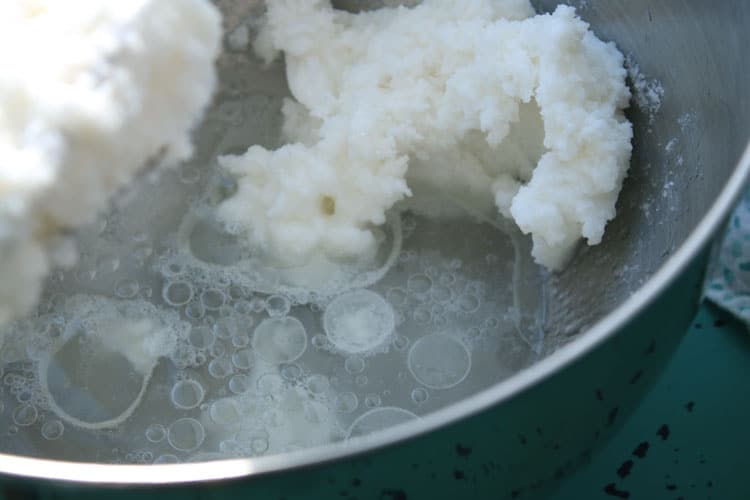 crisco sugar mixture in a pan in boiling water while making easy yeast rolls recipe