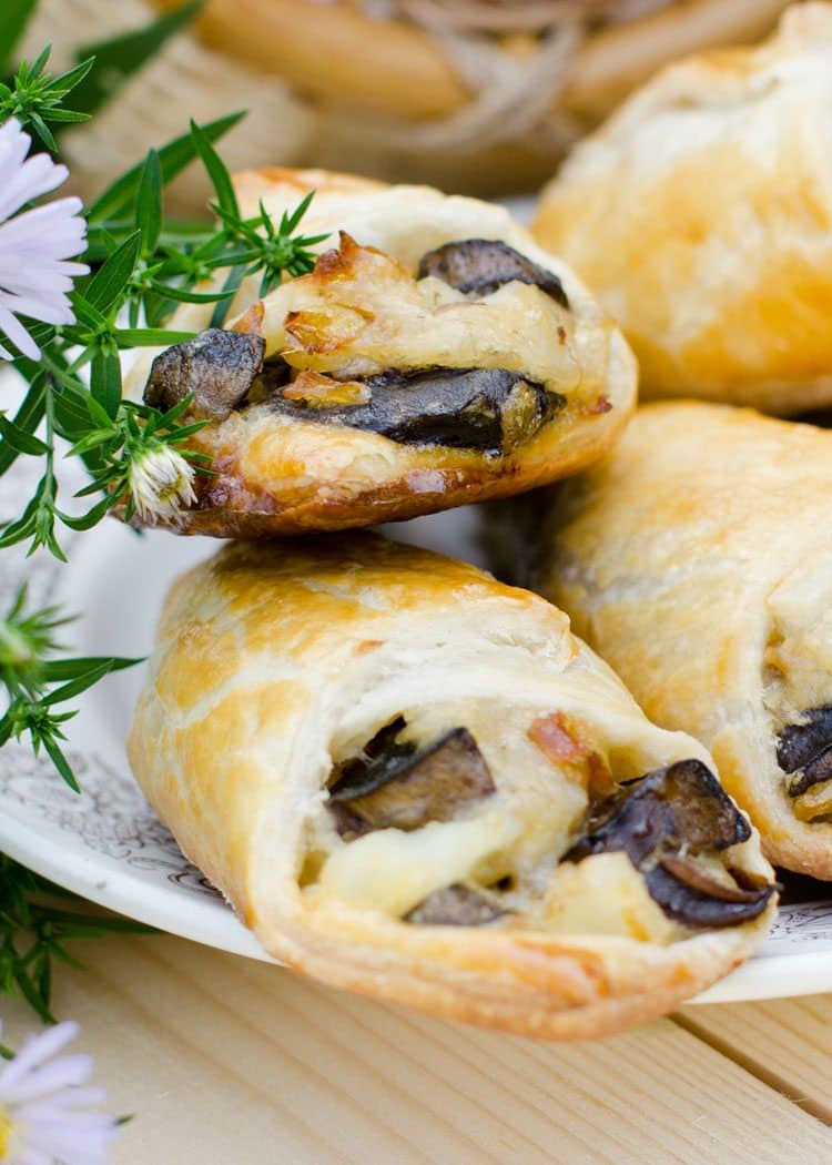 Savory Puff Pastries with Mushrooms and Potatoes on white plate with flower