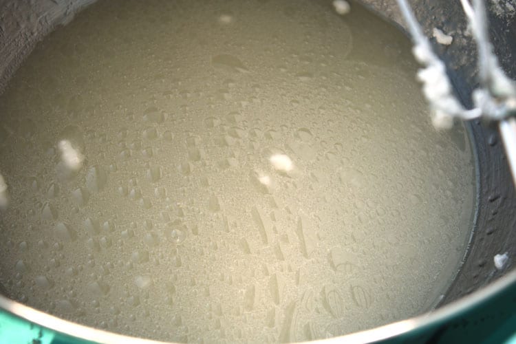 pan containing crisco, sugar, and boiling water mixed to a liquid for easy yeast rolls