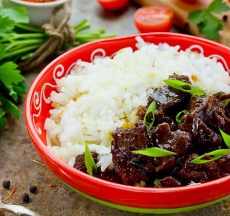 You will love this inspired Copycat Mongolian Beef recipe served with white rice. Easy to make at home and every bit as tasty as the restaraurnt recipe.