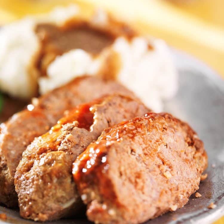 meatloaf with mashed potatoes and gravy on plate