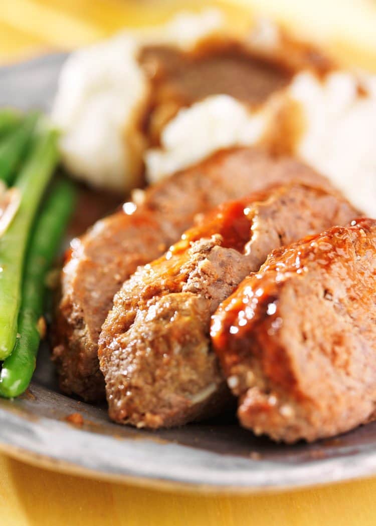 meatloaf with green beans and mashed potatoes on plate 