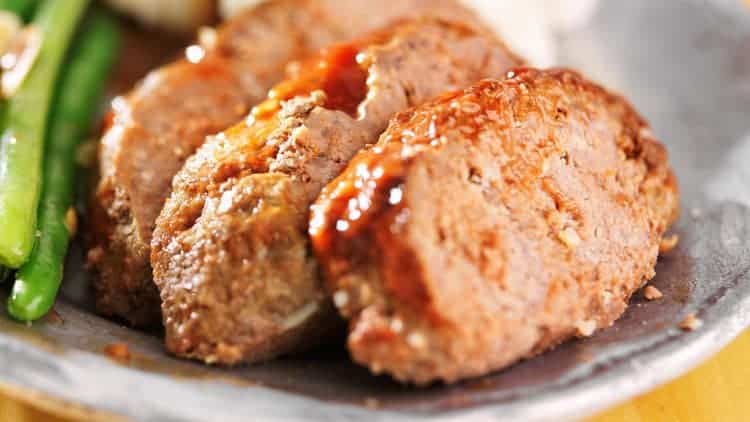 meatloaf with green beans on plate