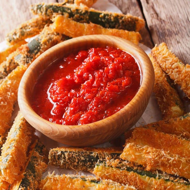 How to make Baked Zucchini Sticks for a healthier zucchini sticks option. Tasty appetizer served with marinara.