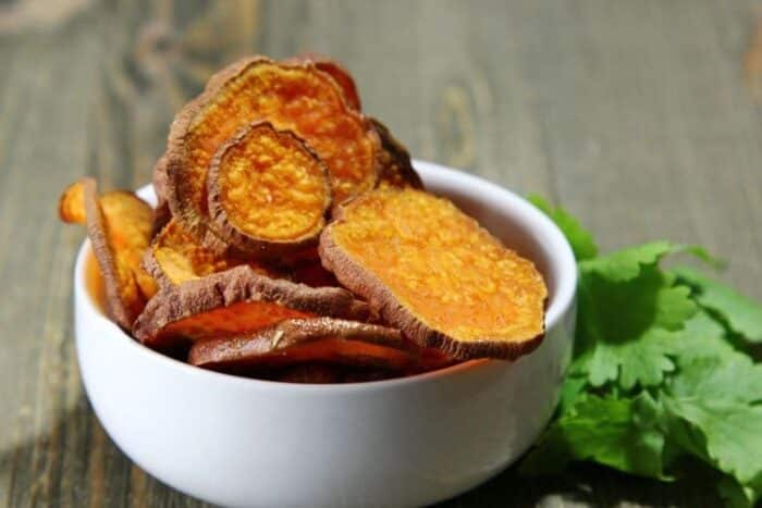 Make these healthy baked sweet potato chips in the oven or your excalibur dehydrator. Best sweet potato chips recipe ever.