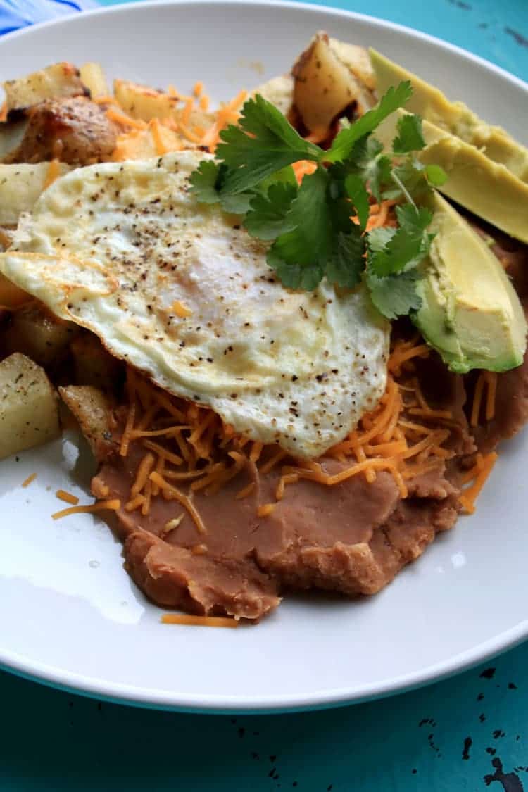 Enjoy Huevos Rancheros for Brunch with Cheesy Ranch Potatoes. This easy recipe can be served up for breakfast, lunch or dinner.