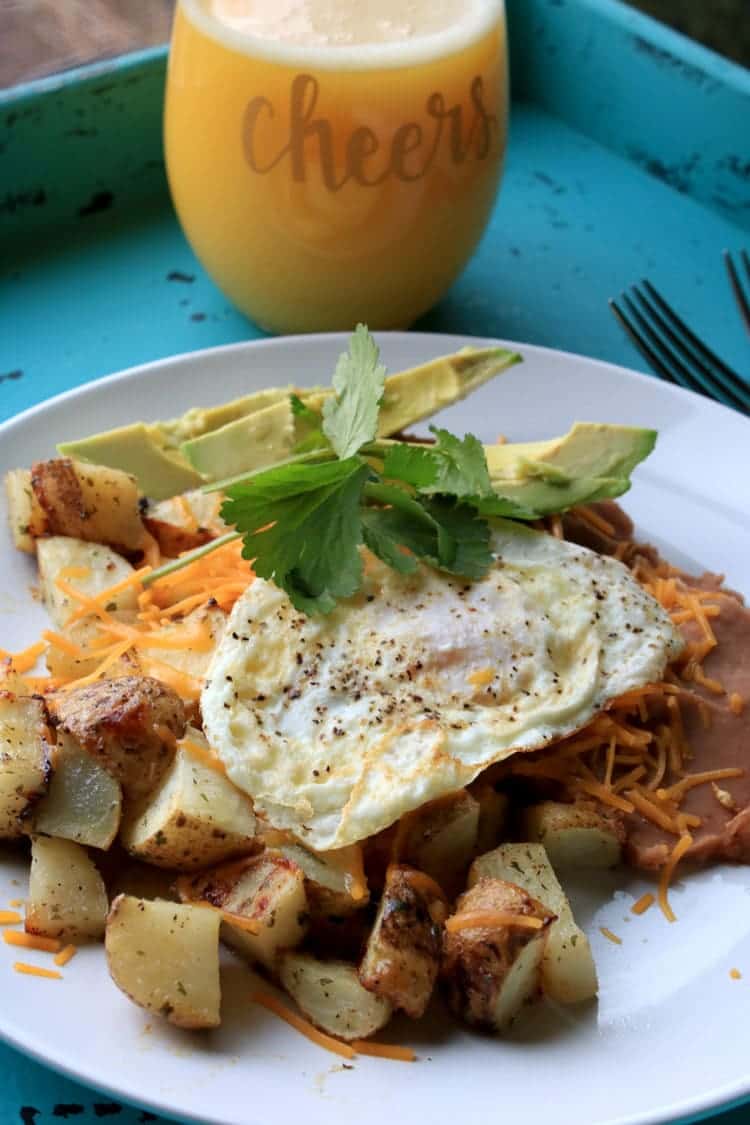 Enjoy Huevos Rancheros for Brunch with Cheesy Ranch Potatoes. This easy recipe can be served up for breakfast, lunch or dinner.