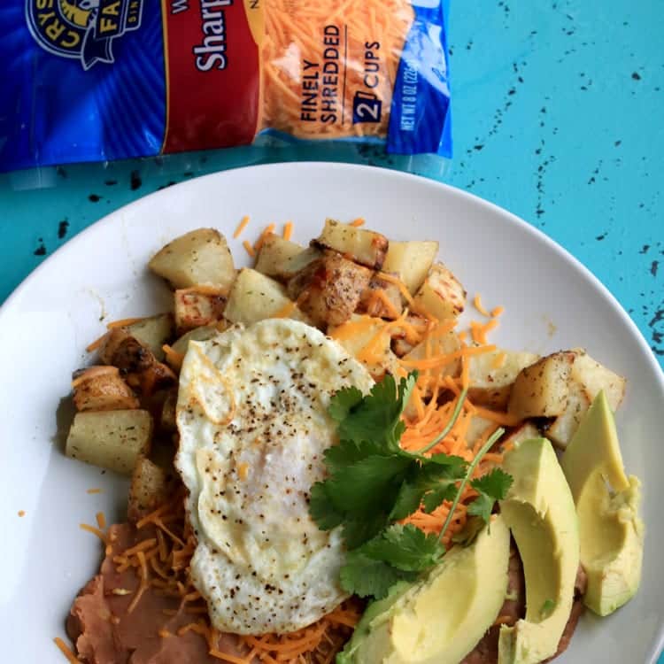 Enjoy Huevos Rancheros for Brunch with Cheesy Ranch Potatoes. This easy recipe can be served up for breakfast, lunch or dinner.