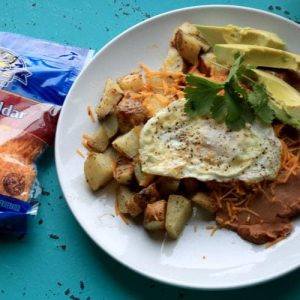 Enjoy Huevos Rancheros for Brunch with Cheesy Ranch Potatoes. This easy recipe can be served up for breakfast, lunch or dinner.