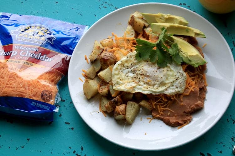 Enjoy Huevos Rancheros for Brunch with Cheesy Ranch Potatoes. This easy recipe can be served up for breakfast, lunch or dinner.