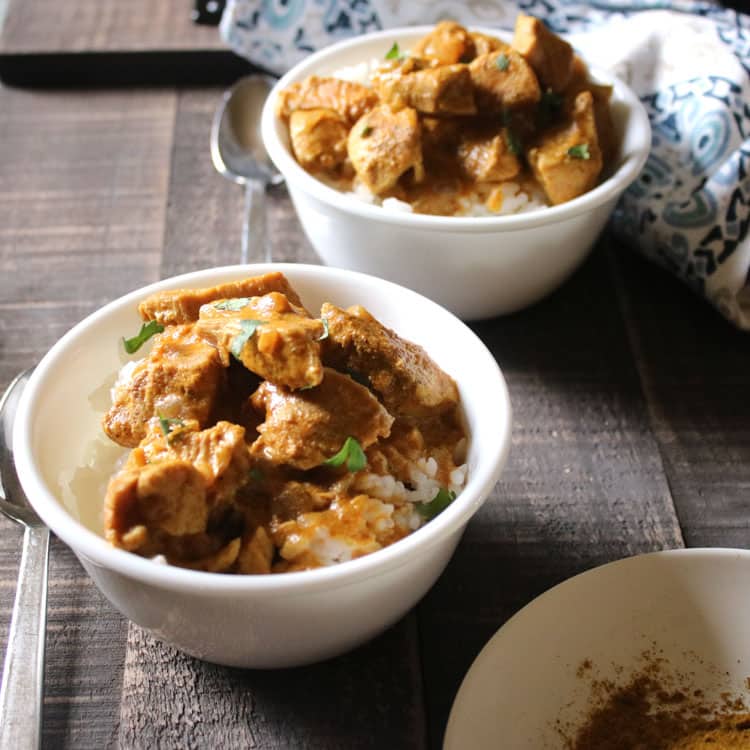 hot chicken curry in white bowl