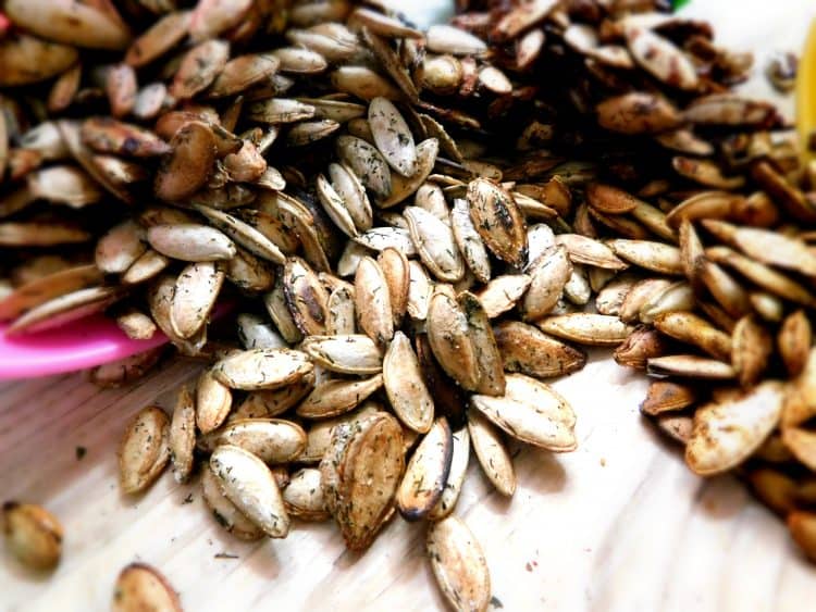 Roasted Pumpkin Seeds on a wood table