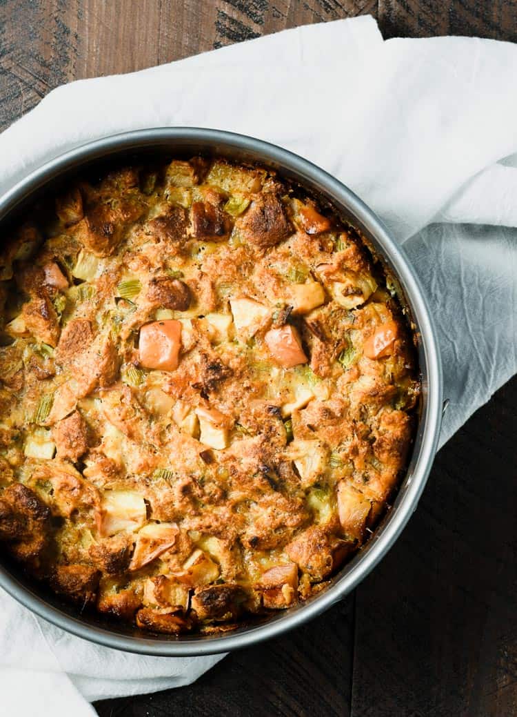 This savory apple bread pudding is made in a springform pan to create an easily to serve side dish