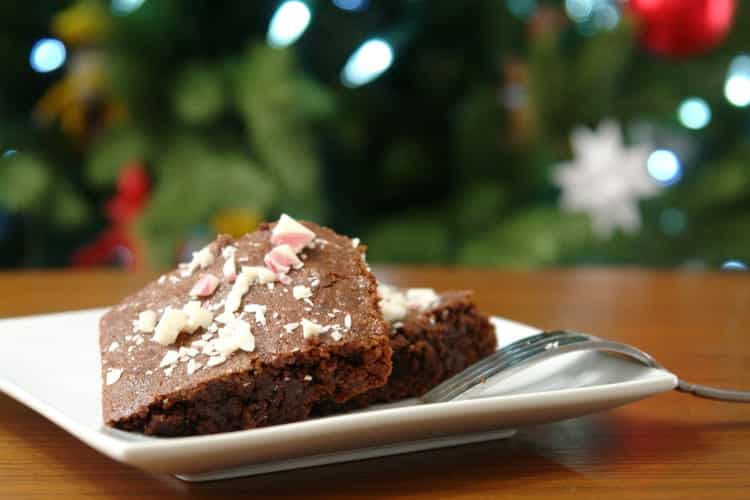 Peppermint Brownies with a christmas tree in the background