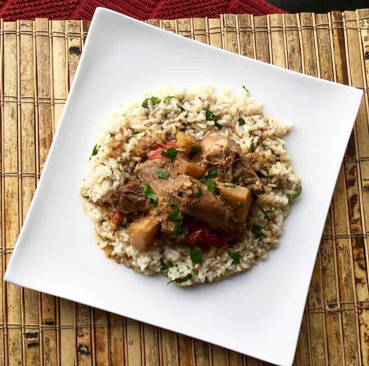 cilantro rice with chicken on white plate