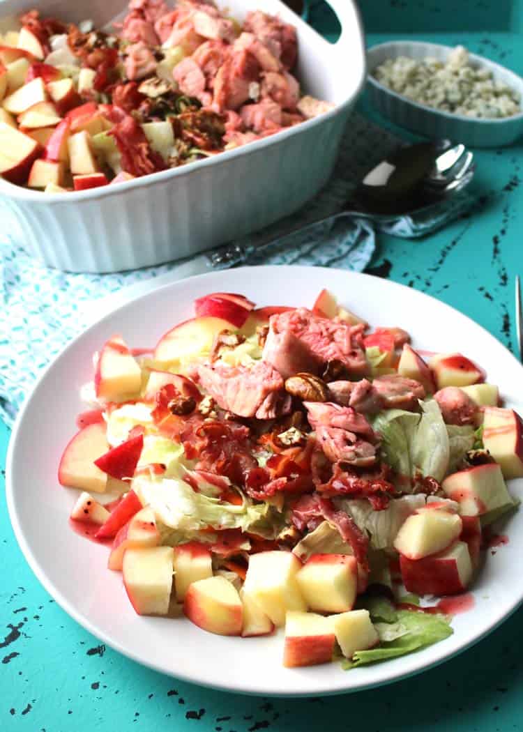 salad with apples and nuts on white plate
