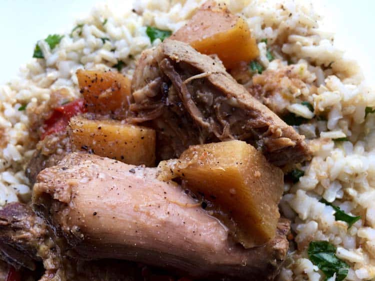 Pineapple Pork Butt on rice on white plate