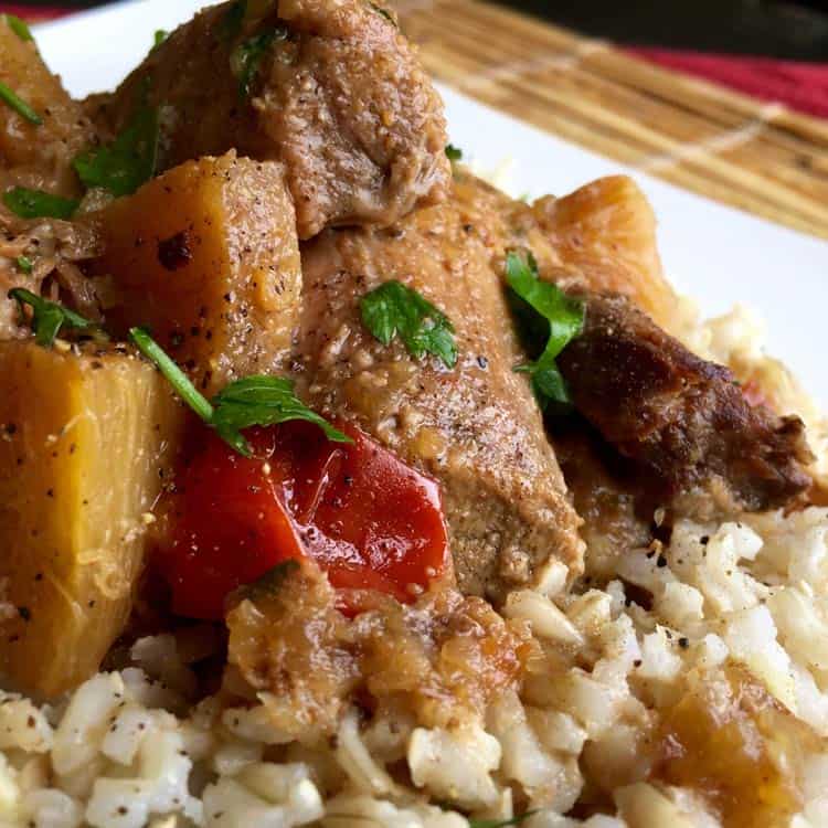 Pineapple Pork Butt on rice on white plate