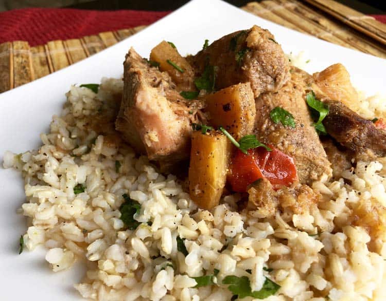 Pineapple Pork Butt on rice on white plate