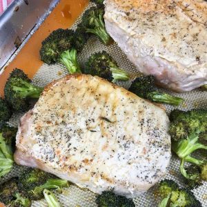 pork chops and broccoli in roasting pan