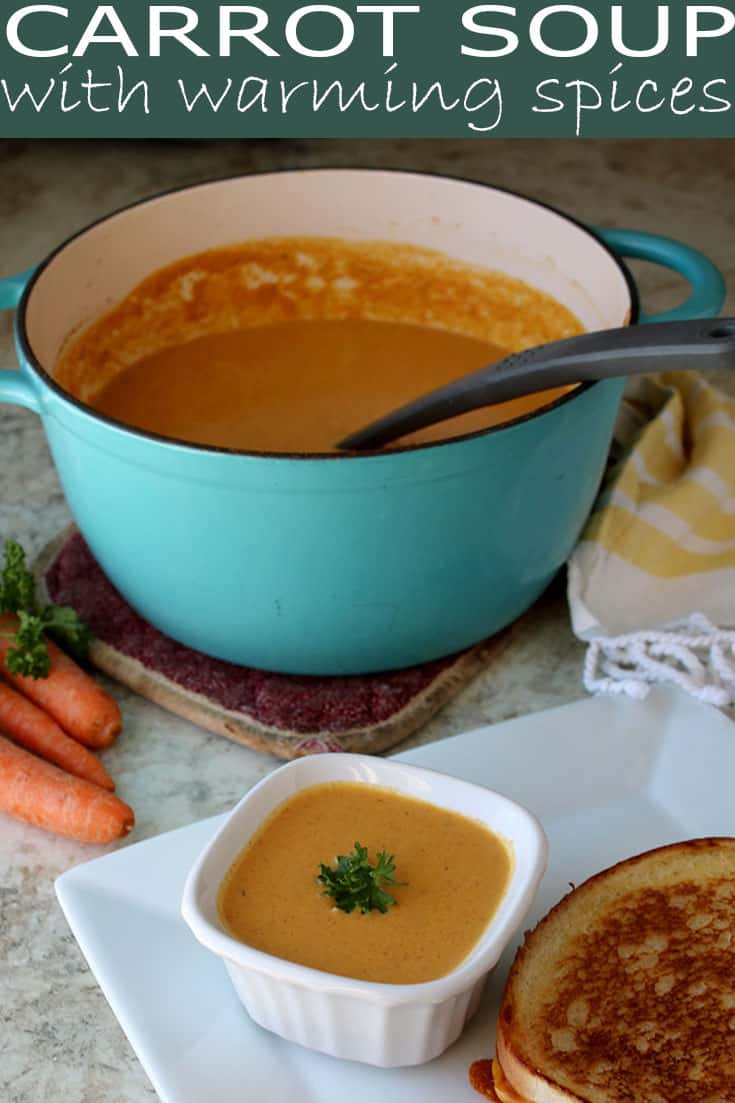 Creamy Carrot Soup with Warming Spices is a warming soup recipe (with step by step photos) you'll find yourself making over and over again in the colder months. The sweetness of the carrots pairs perfectly with the sweet-spiciness of ginger, cinnamon, cumin, and allspice. #souprecipes #roasted #fallflavors #warmingspices